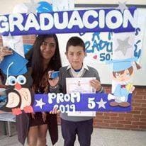 Gabriel with his teacher on his 5th grade gaduation