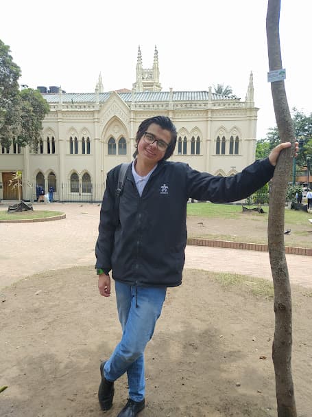 Me in front of a white building