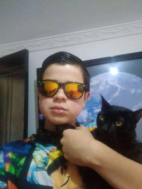Gabriel with his black cat